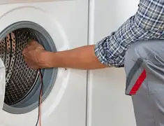 Dryer repair technician diagnosing and servicing a clothes dryer in Naperville, IL