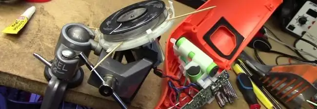 Vacuum cleaner repair parts and tools on a workbench in Naperville, IL